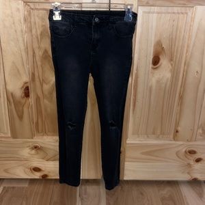 extra small shein black skinny jeans. ripped in the knees.